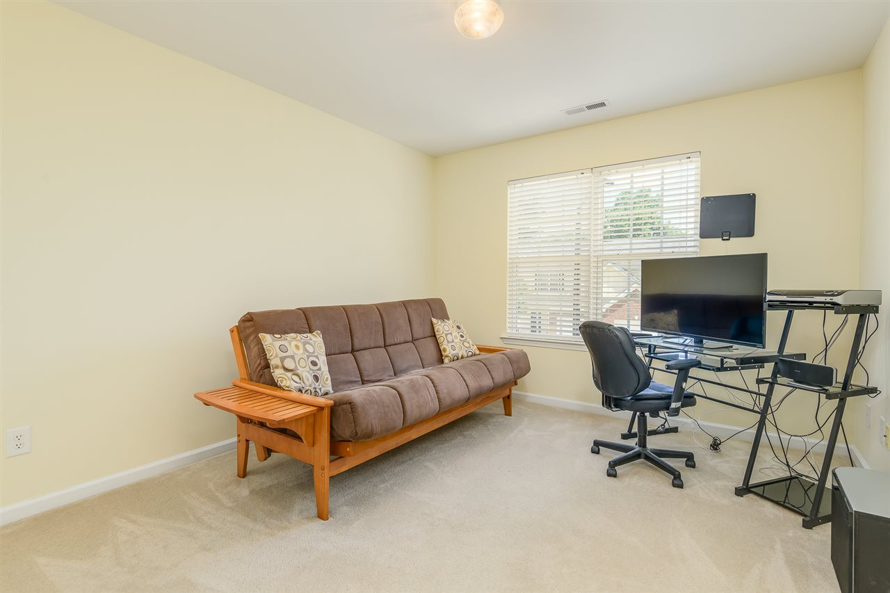 3525 Oneonta Avenue Raleigh, NC 27604 - Photo 18 of 22 a living room with furniture and a flat screen tv