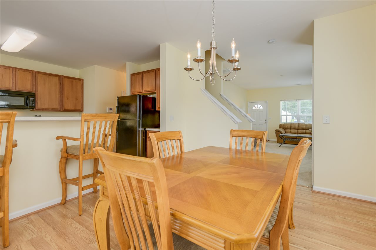 3525 Oneonta Avenue Raleigh, NC 27604 - Photo 8 of 22 a view of a dining room with furniture and wooden floor