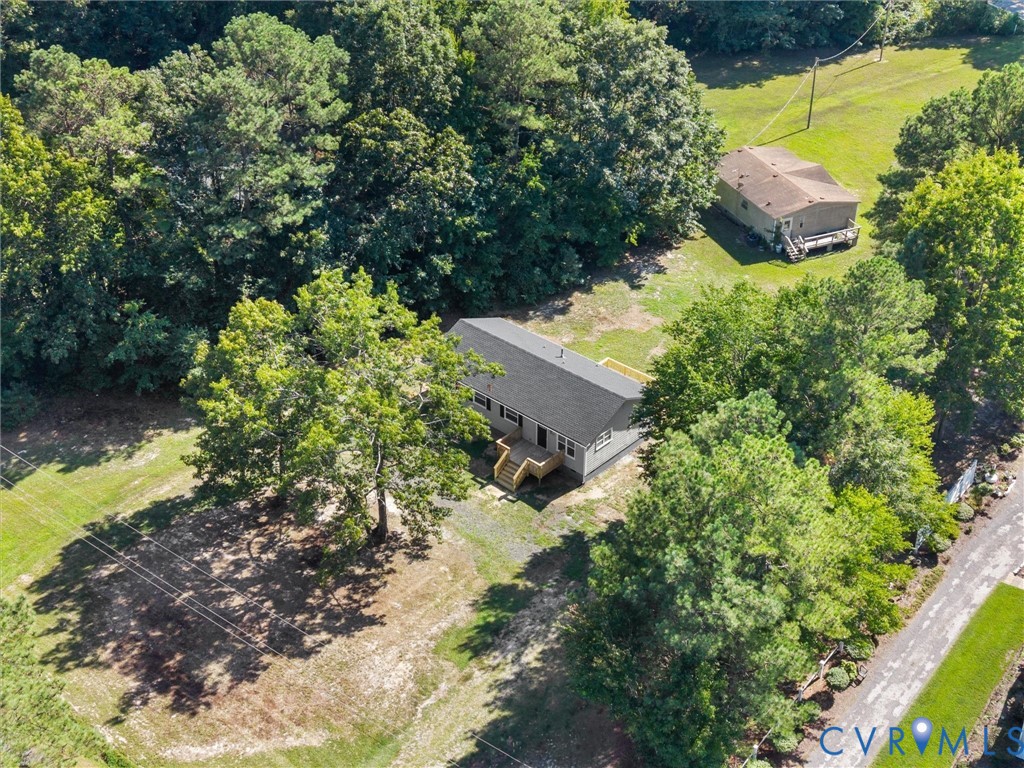 6927 Carsley Road Waverly, VA 23890 - Photo 44 of 51 Expansive outdoor space featuring a grey-sided str