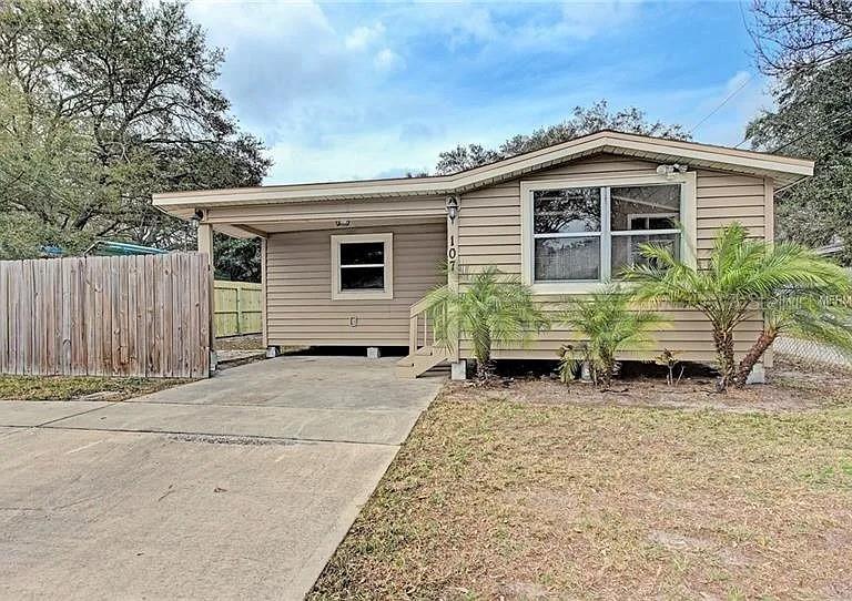 107 6th Street Northeast Largo, FL 33770 - Photo 1 of 1 a backyard of a house with yard and outdoor seating