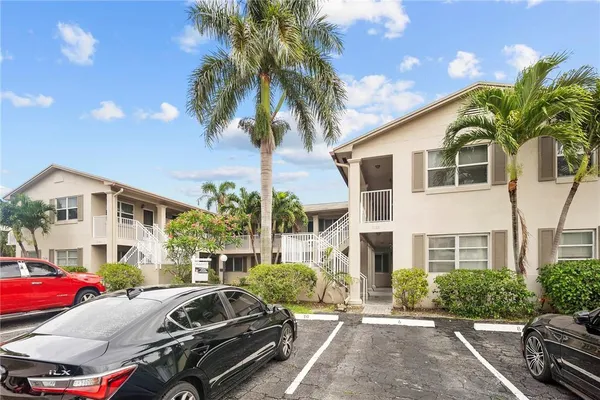 a front view of a house with parking space
