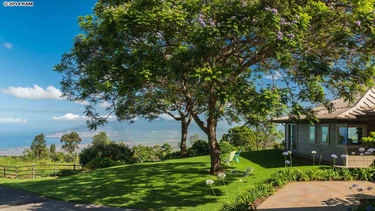 8037 Kula Highway Kula, HI 96790 - Photo 1 of 30 a view of a fountain in front of a house with a big yard