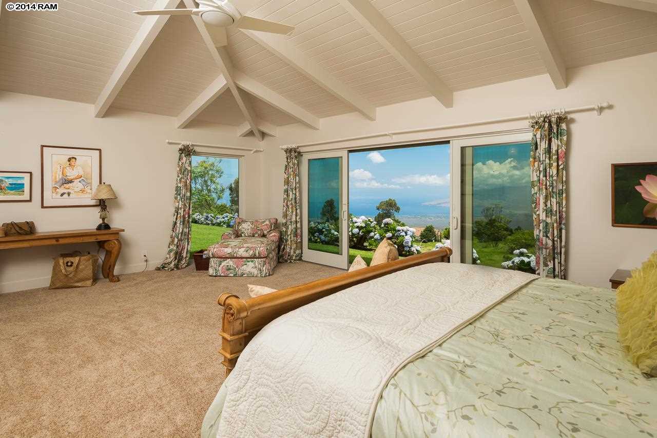 8037 Kula Highway Kula, HI 96790 - Photo 11 of 30 a bed room with a bed and a large window
