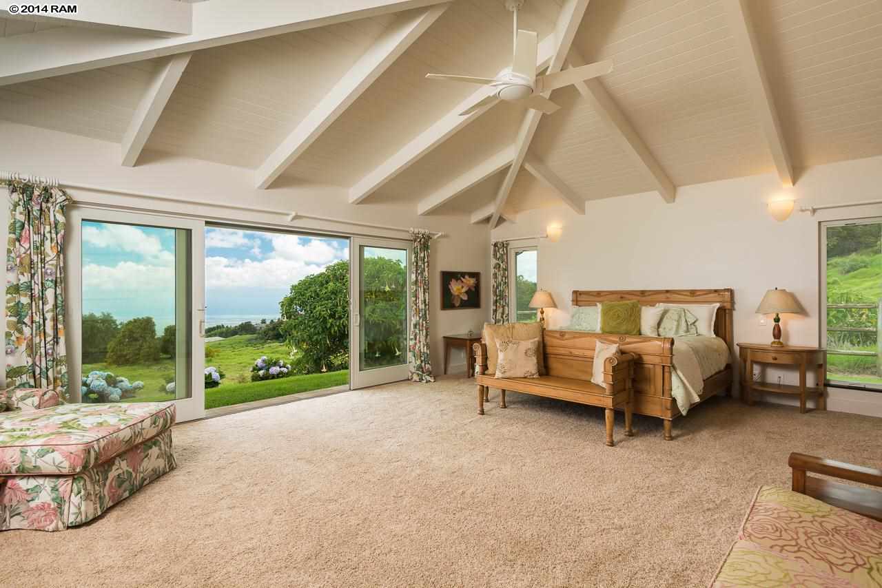 8037 Kula Highway Kula, HI 96790 - Photo 12 of 30 a bedroom with furniture and large windows