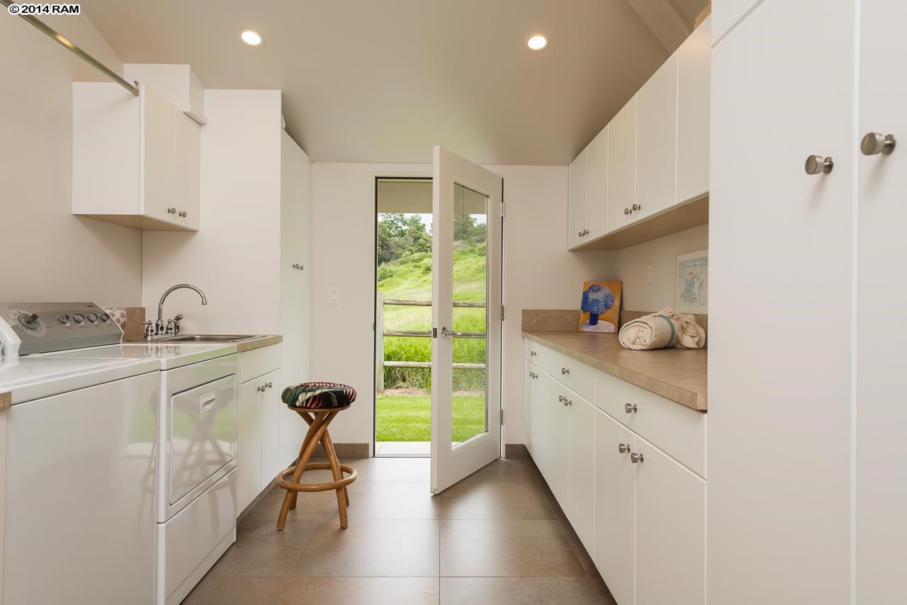 8037 Kula Highway Kula, HI 96790 - Photo 17 of 30 a kitchen with sink cabinets and window