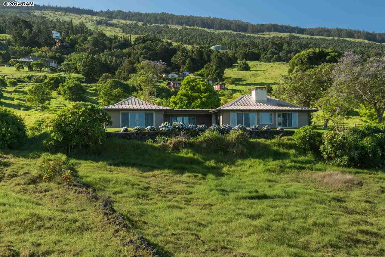 8037 Kula Highway Kula, HI 96790 - Photo 24 of 30 a view of a lake with a house in the background