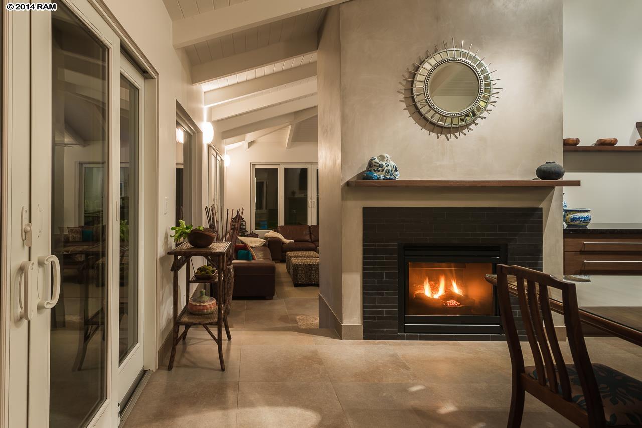 8037 Kula Highway Kula, HI 96790 - Photo 4 of 30 a living room with furniture a fireplace and a fireplace