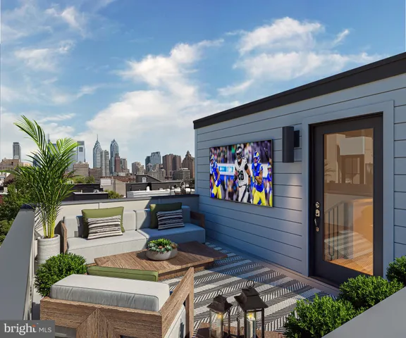 a view of a chairs and table in a backyard