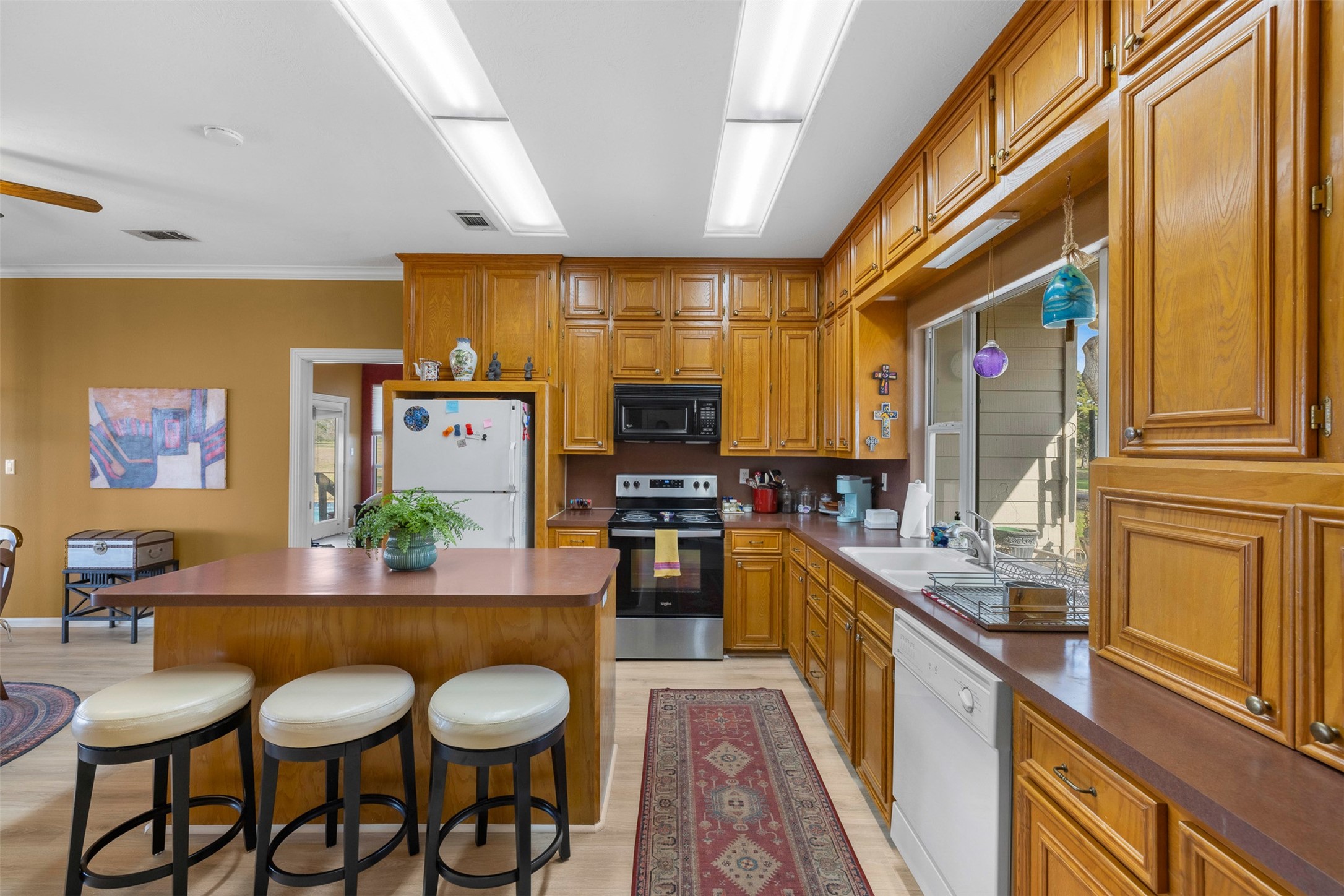 2346 Bruno Road Schulenburg, TX 78956 - Photo 15 of 49 a kitchen with granite countertop lots of counter top space and stainless steel appliances