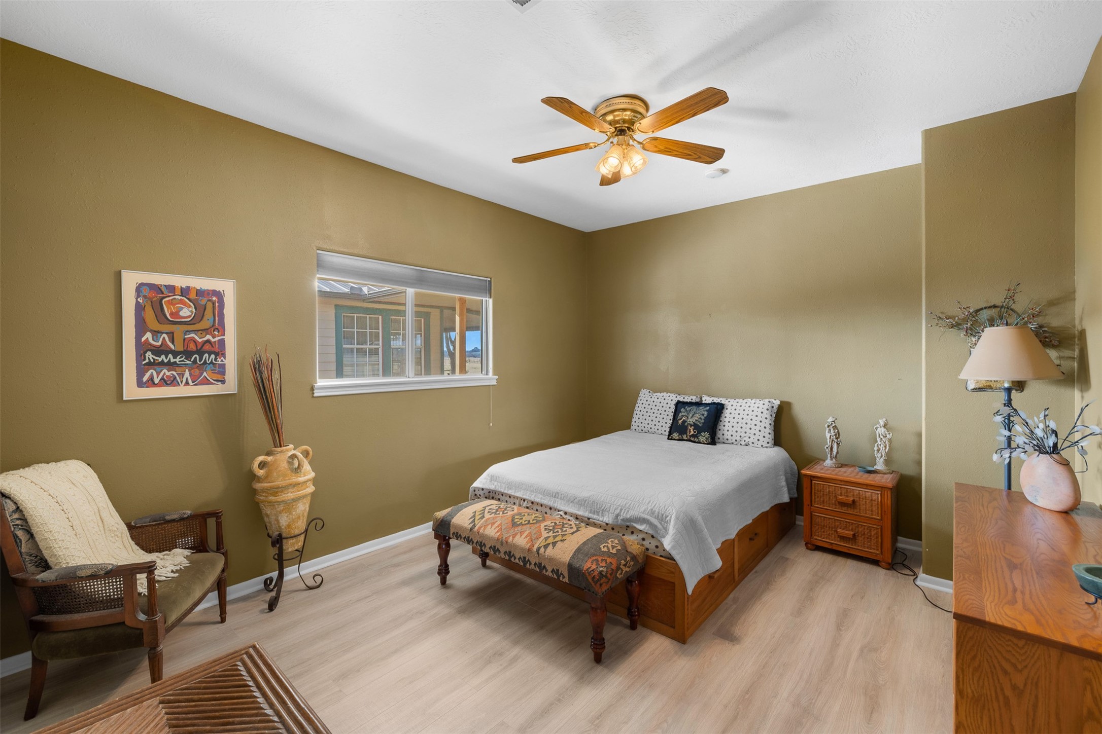 2346 Bruno Road Schulenburg, TX 78956 - Photo 21 of 49 a bedroom with a bed and a chandelier