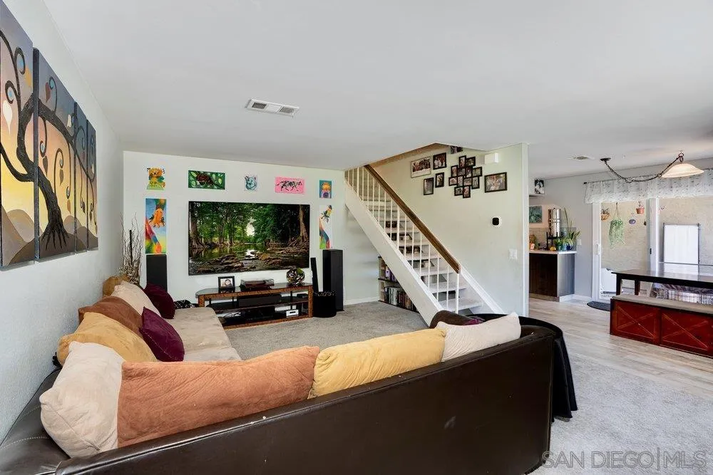 13358 Birch Tree Lane Poway, CA 92064 - Photo 2 of 16 a living room with furniture and a flat screen tv