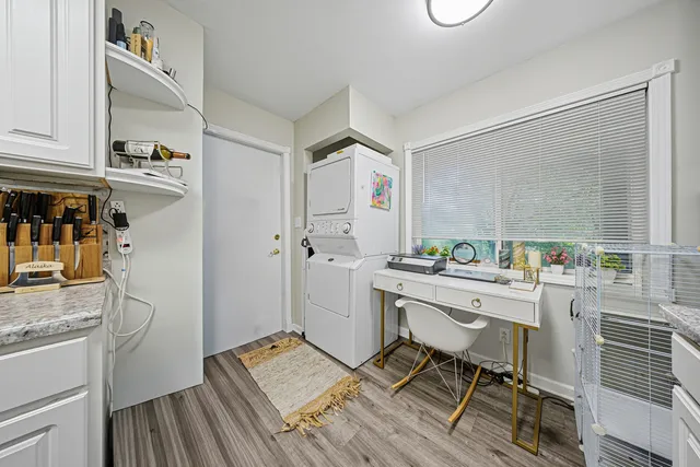 a room with a sink and a wooden floor