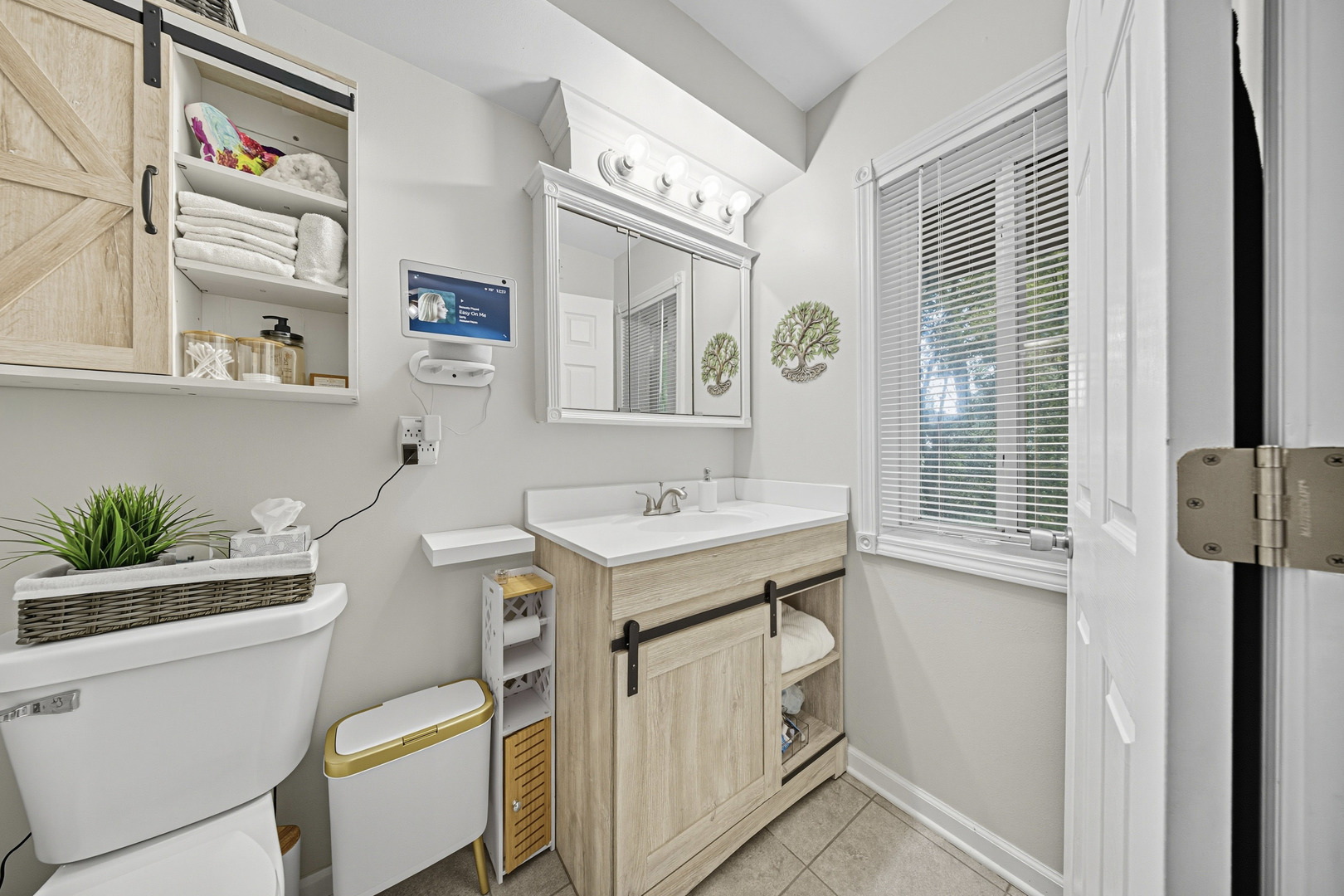 1942 Tall Oaks Drive, Unit 1A Aurora, IL 60505 - Photo 10 of 13 a bathroom with a sink toilet and window