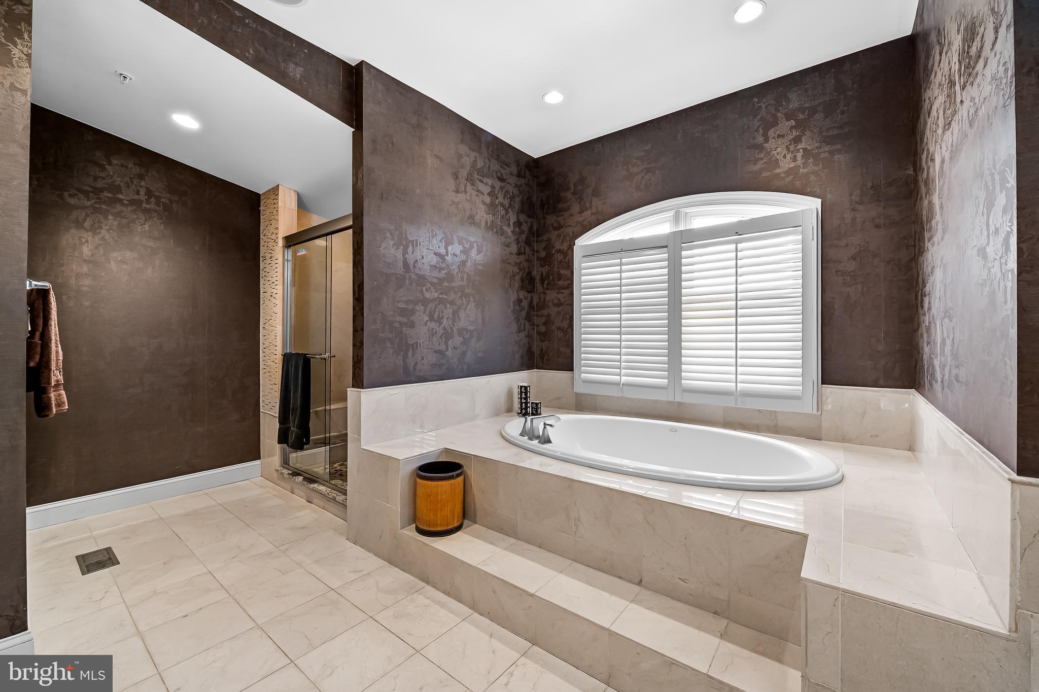 2323 Boston Street, Unit 6 Baltimore, MD 21224 - Photo 25 of 47 a spacious bathroom with a granite countertop tub sink and mirror