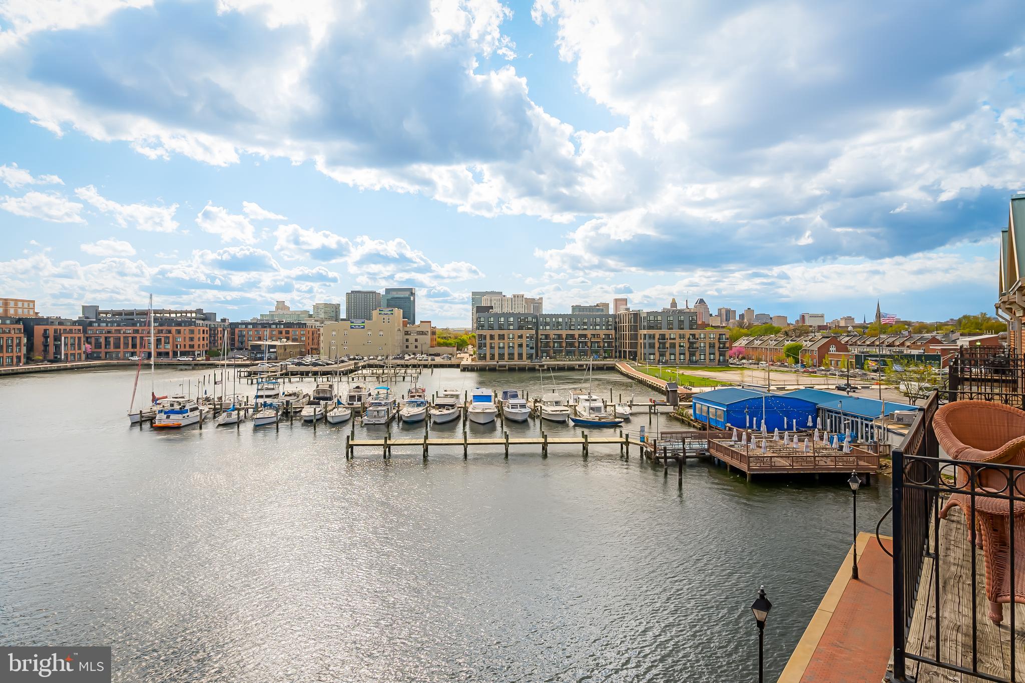 2323 Boston Street, Unit 6 Baltimore, MD 21224 - Photo 29 of 47 a view of a lake with boats and trees in the background