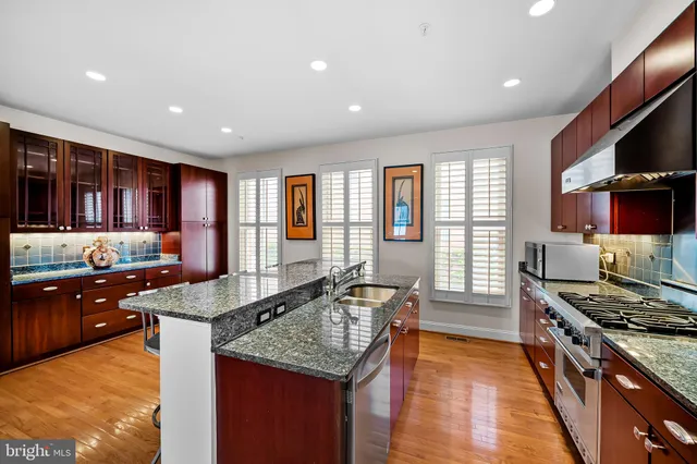 a kitchen with lots of counter top space and living room
