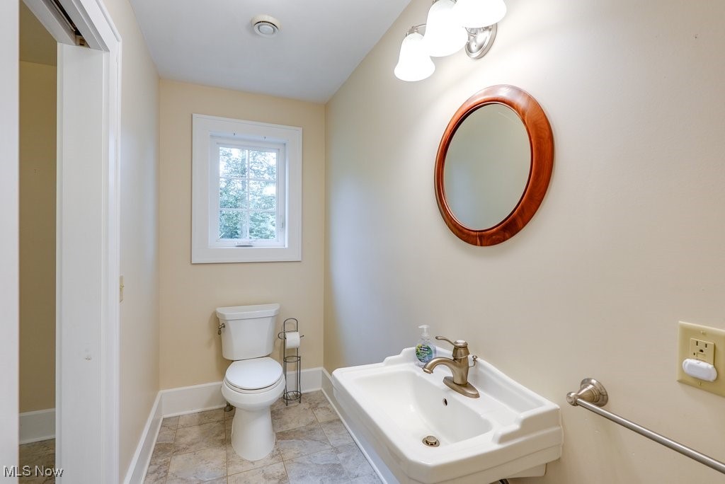 2980 Luli Road Mogadore, OH 44260 - Photo 32 of 50 Bathroom featuring sink, tile patterned flooring, and toilet