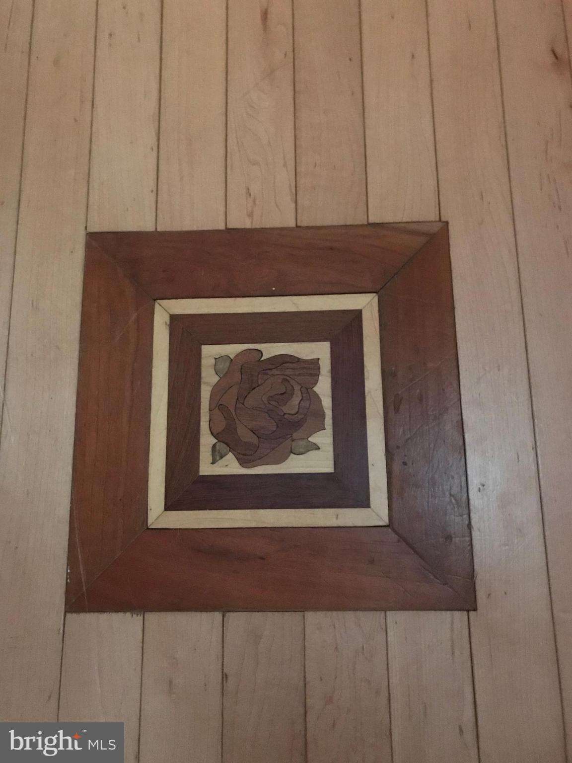 3 Heather Road Newark, DE 19702 - Photo 34 of 50 Floor inlay at bottom of stairs