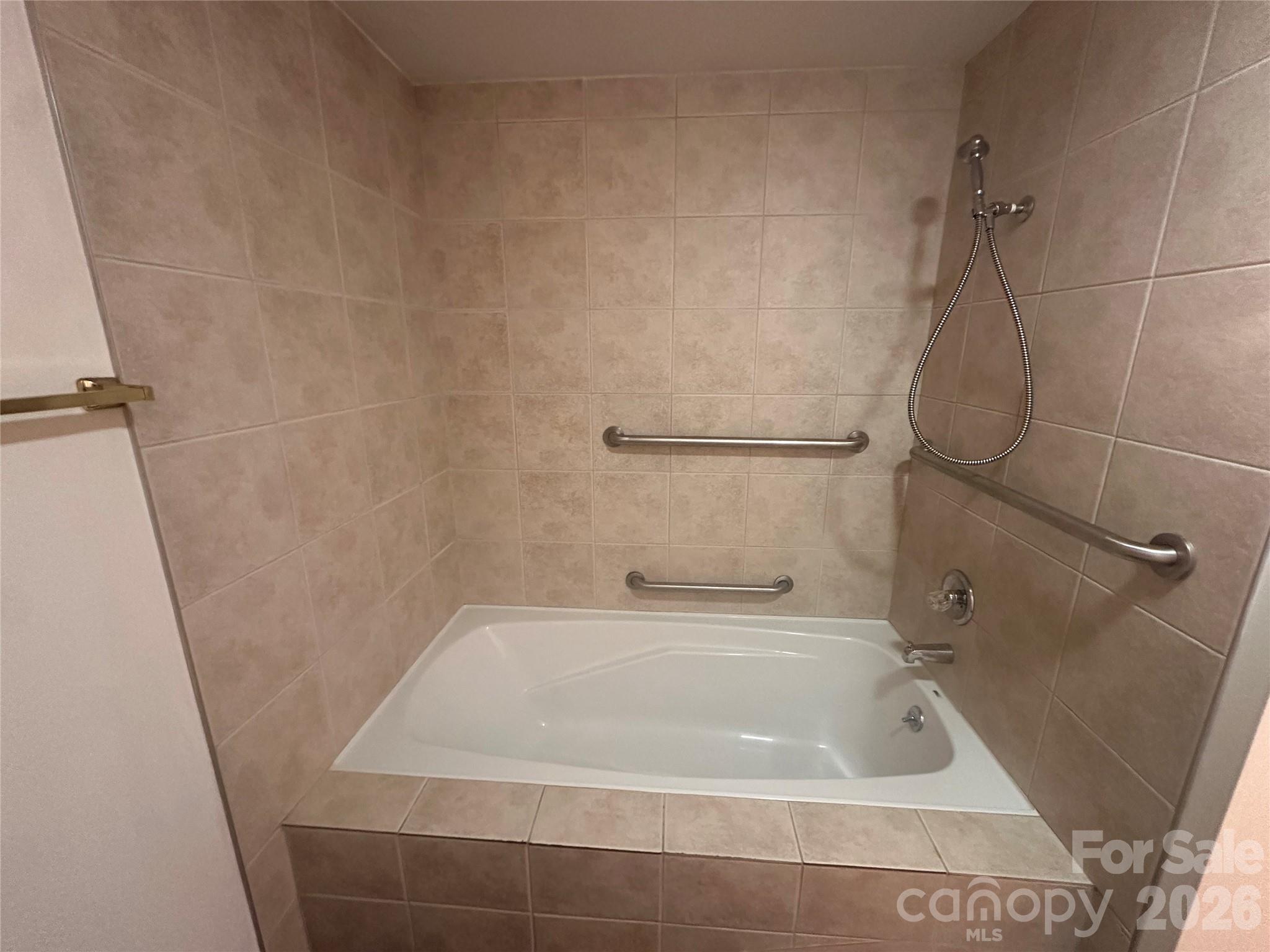 12087 Traphill Road Traphill, NC 28685 - Photo 25 of 40 a bath tub sitting next to a white sink