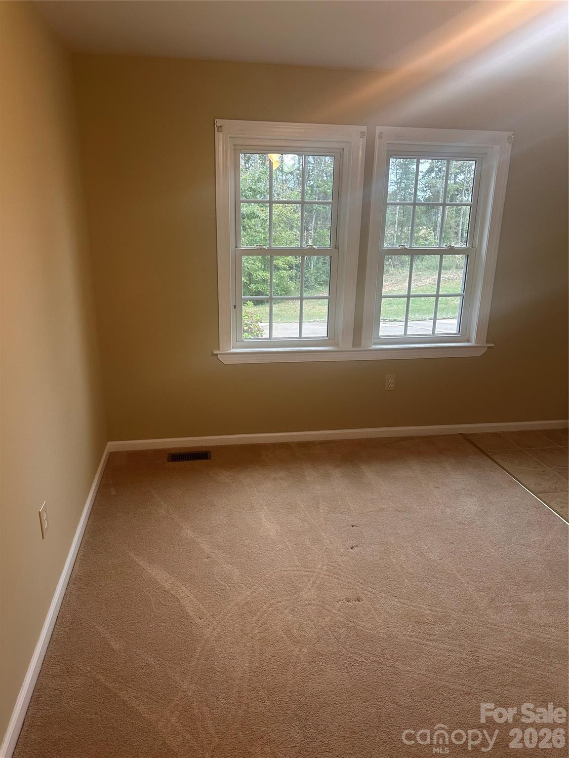 12087 Traphill Road Traphill, NC 28685 - Photo 32 of 40 an empty room with a window