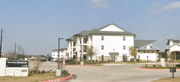 a view of a building and a street