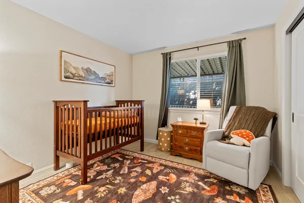 a bedroom with furniture and a window