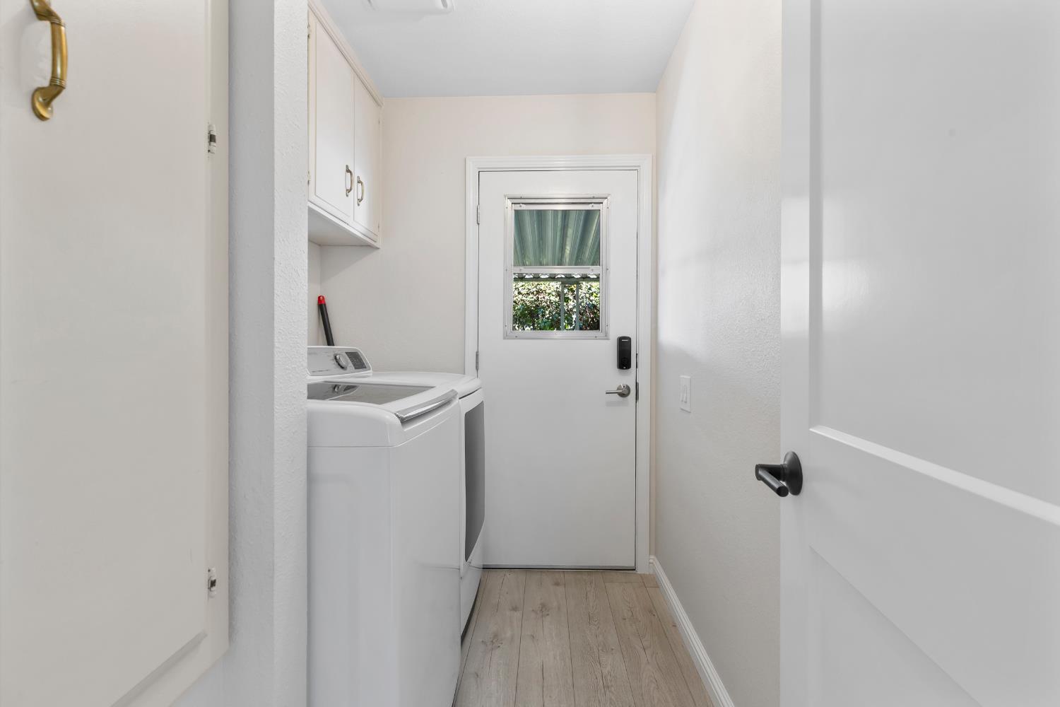 2841 Fowler Road, Unit 89 Ceres, CA 95307 - Photo 16 of 32 a view of a bathroom with sink window and wooden floor