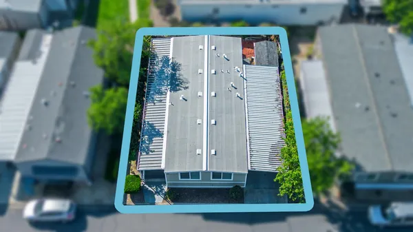 an aerial view of a house with a garden