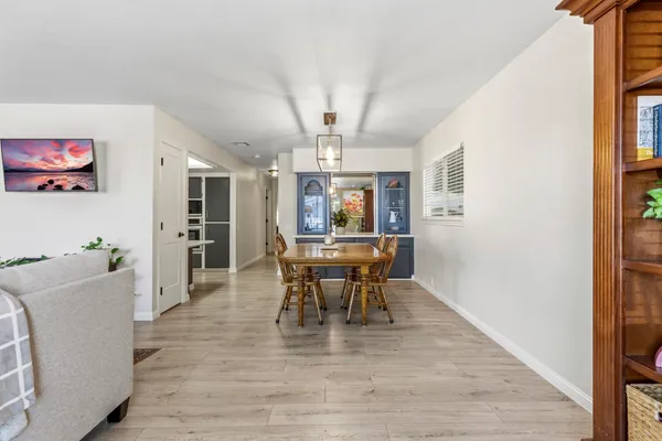 a view of a dining room with furniture and window
