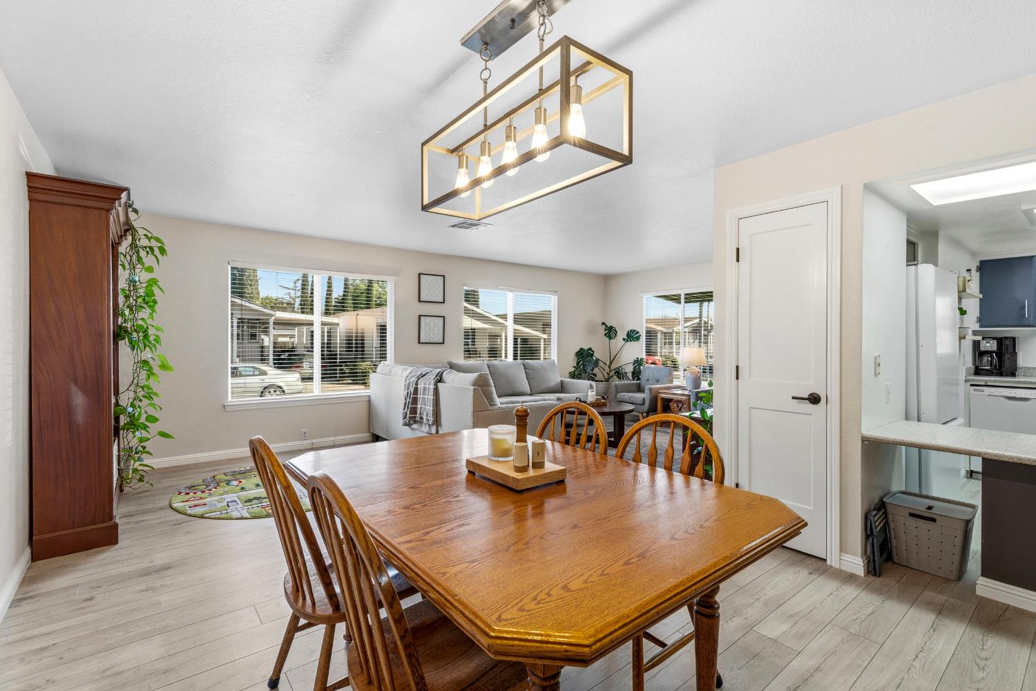 2841 Fowler Road, Unit 89 Ceres, CA 95307 - Photo 8 of 32 a view of a dining room with furniture and wooden floor