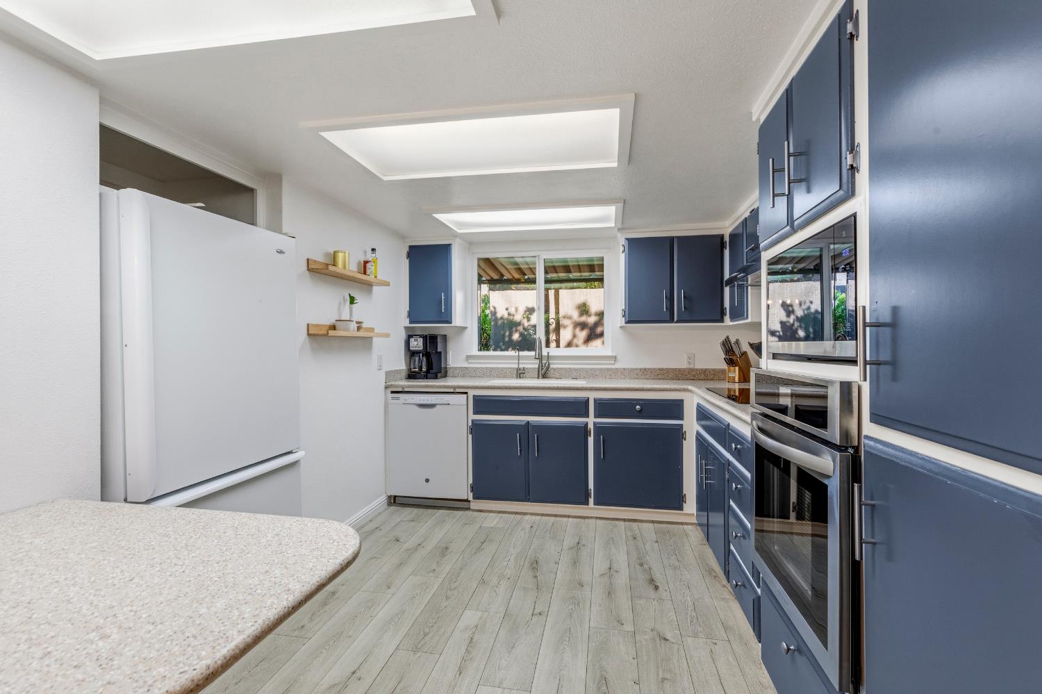 2841 Fowler Road, Unit 89 Ceres, CA 95307 - Photo 10 of 32 a kitchen with stainless steel appliances granite countertop a refrigerator and a stove