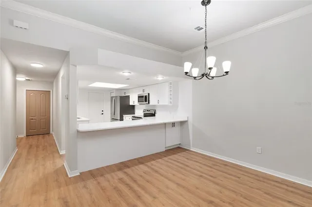 a large kitchen with stainless steel appliances