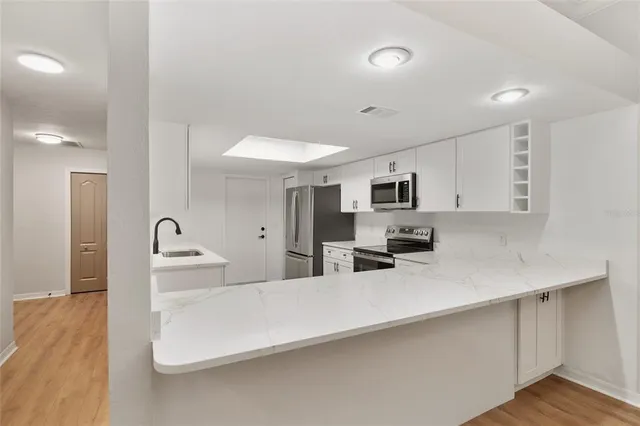 a kitchen with cabinets a sink and dishwasher