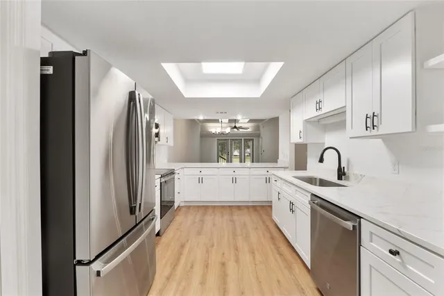 a bathroom with a double vanity sink and mirror