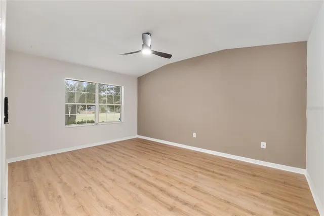 a bathroom with a sink and two mirror