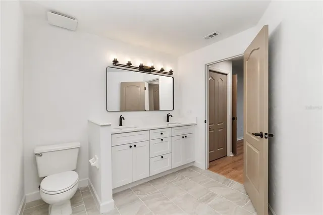 a bathroom with a bath tub with a shower