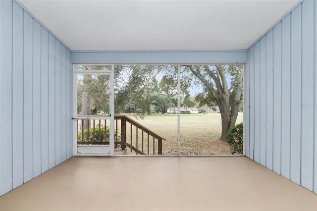 an aerial view of a houses with a yard