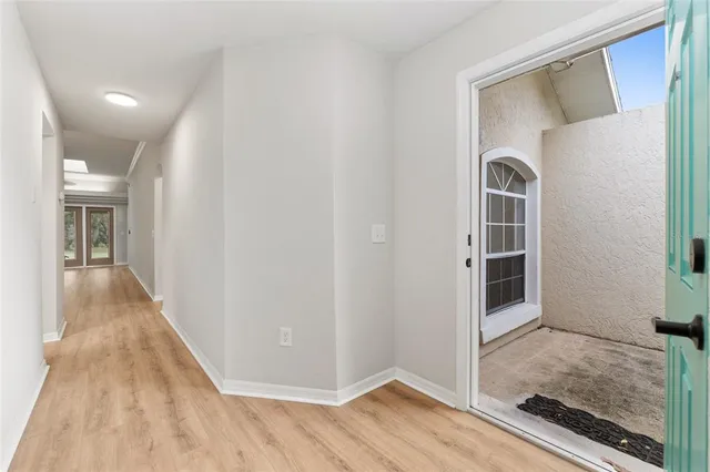 an empty room with closet and a bathroom