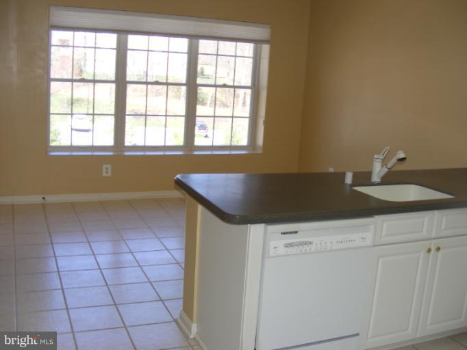 12000 Tralee Road, Unit 304 Lutherville-Timonium, MD 21093 - Photo 3 of 9 a view of a kitchen with a sink