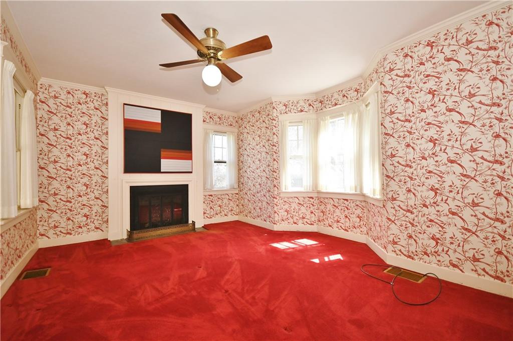 405 East Waldheim Road Pittsburgh, PA 15215 - Photo 13 of 25 Master bedroom boasts fireplace and a view of sun room.