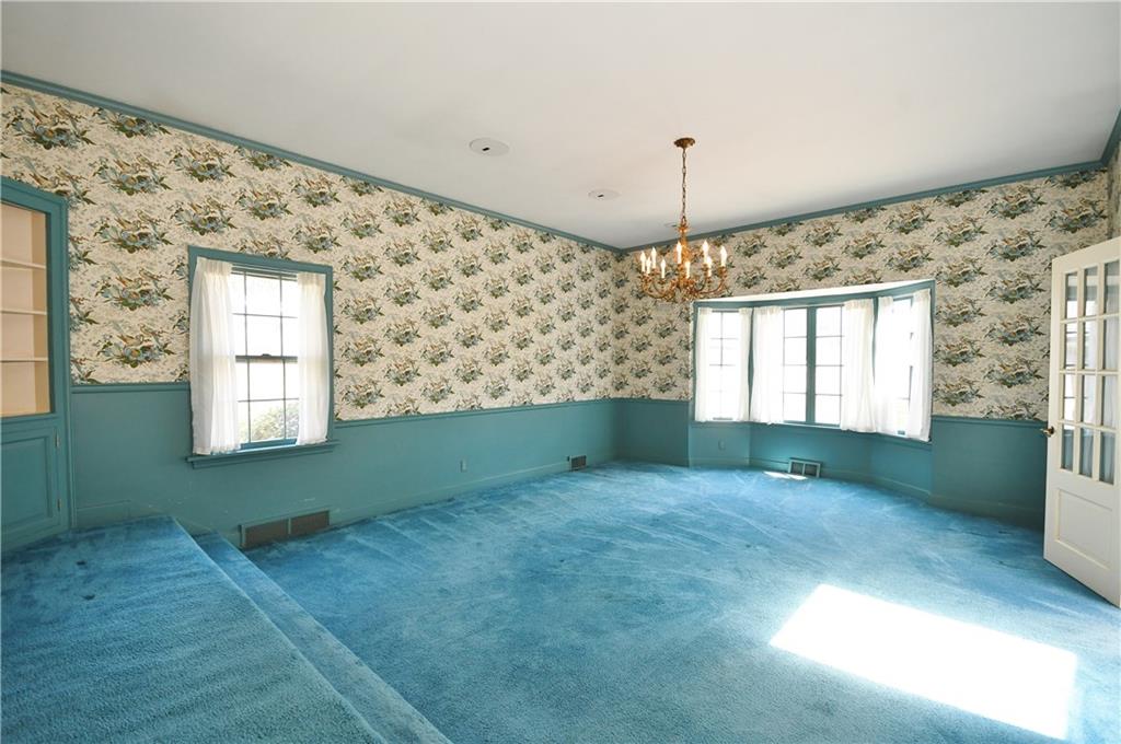 405 East Waldheim Road Pittsburgh, PA 15215 - Photo 5 of 25 Sunken dining room features a large bay window and access to sun room. Hardwood floors under carpet.
