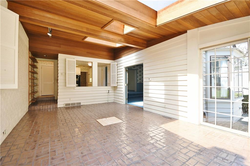 405 East Waldheim Road Pittsburgh, PA 15215 - Photo 6 of 25 Beamed ceilings with skylights are featured in the sun room which is open to kitchen and dining room.