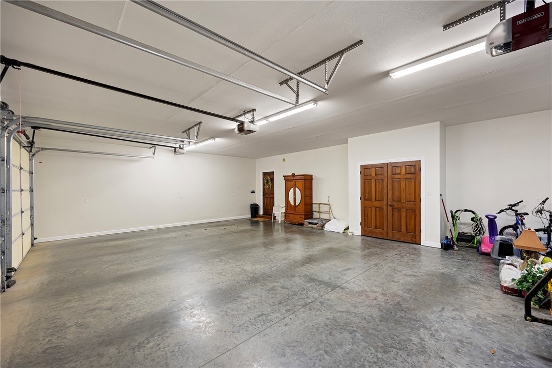 788 Cliff Road Russellville, AR 72802 - Photo 60 of 60 Garage featuring a garage door opener and baseboards