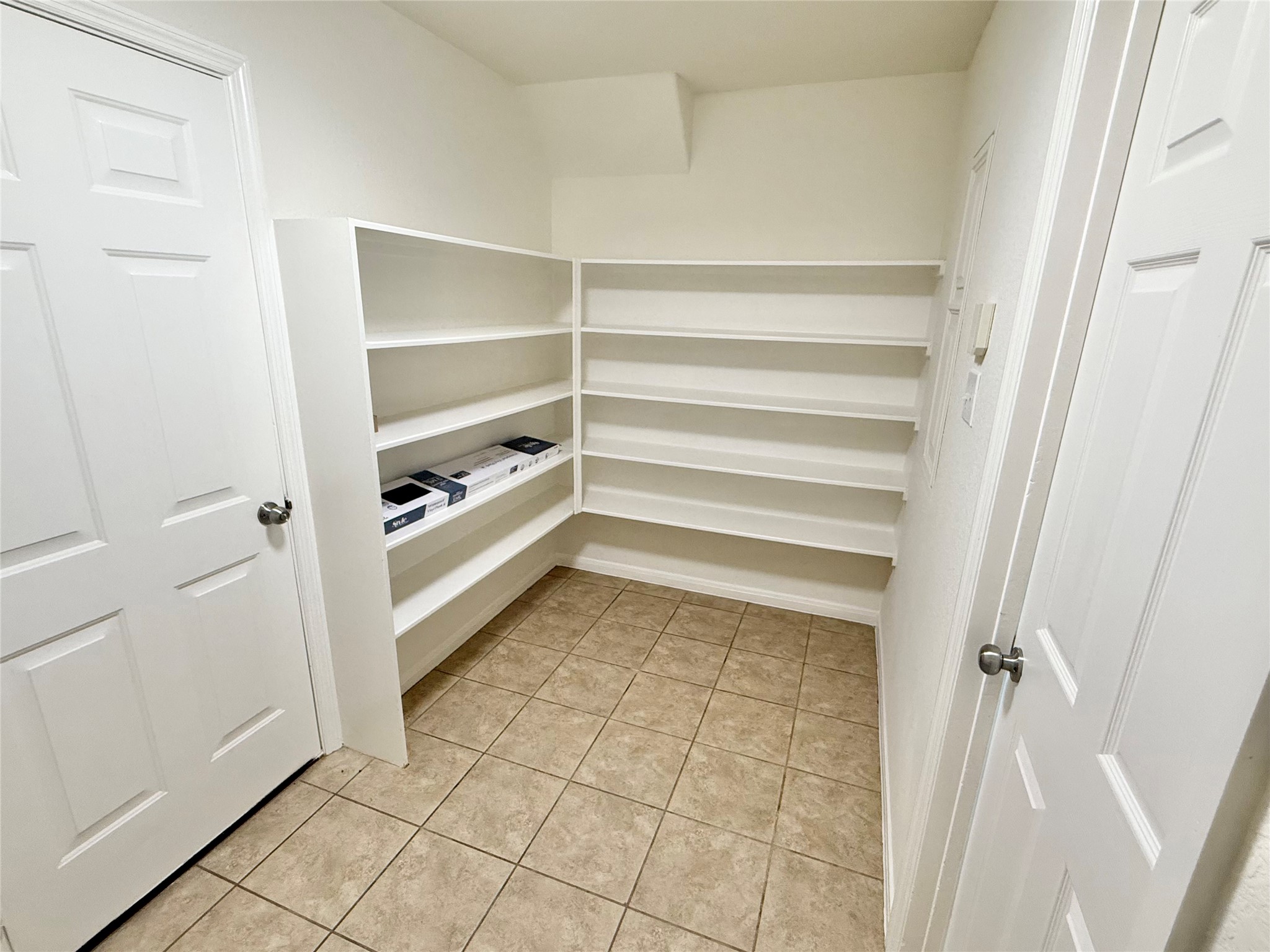 3430 Falcon Trail Court Spring, TX 77373 - Photo 14 of 31 Walk-in pantry off the kitchen, with direct access to the garage.