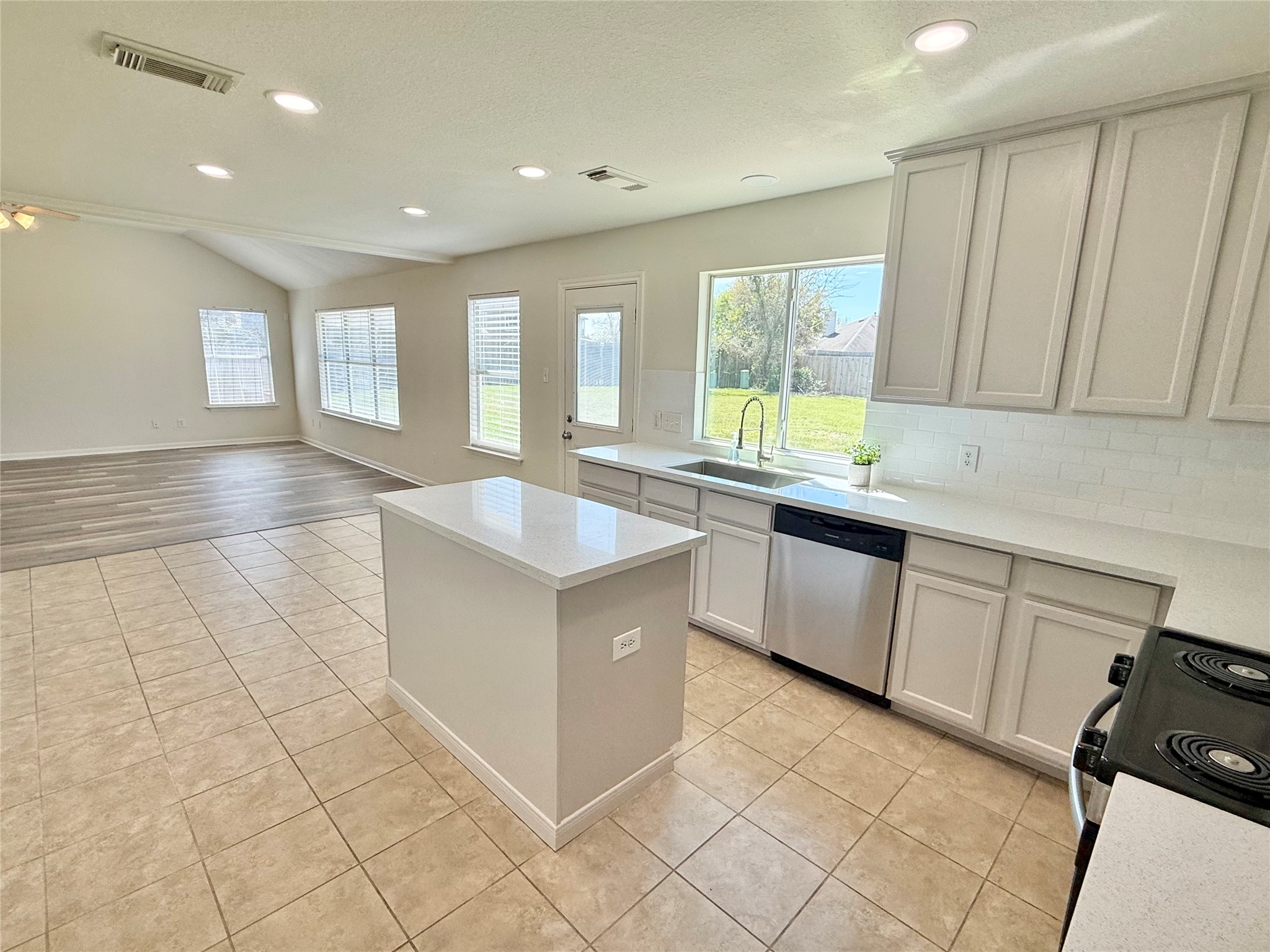 3430 Falcon Trail Court Spring, TX 77373 - Photo 9 of 31 Another view of the kitchen and living room, overlooking the expansive backyard!