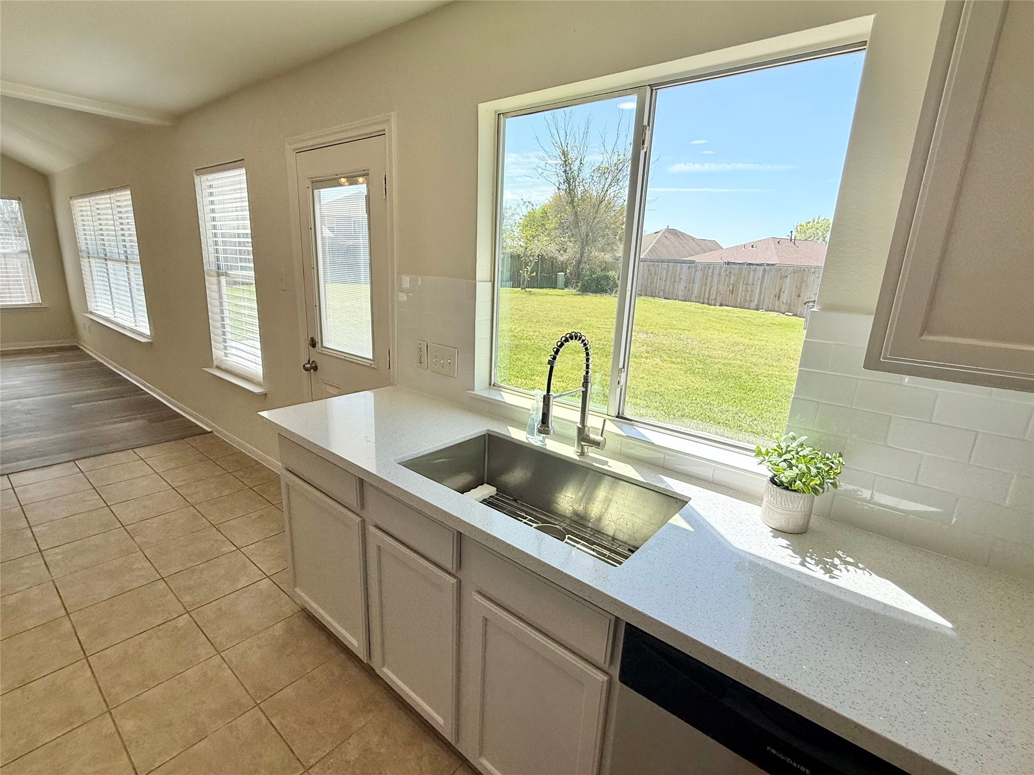 3430 Falcon Trail Court Spring, TX 77373 - Photo 10 of 31 Overlook the spacious backyard while doing dishes in this brand new stainless steel sink.