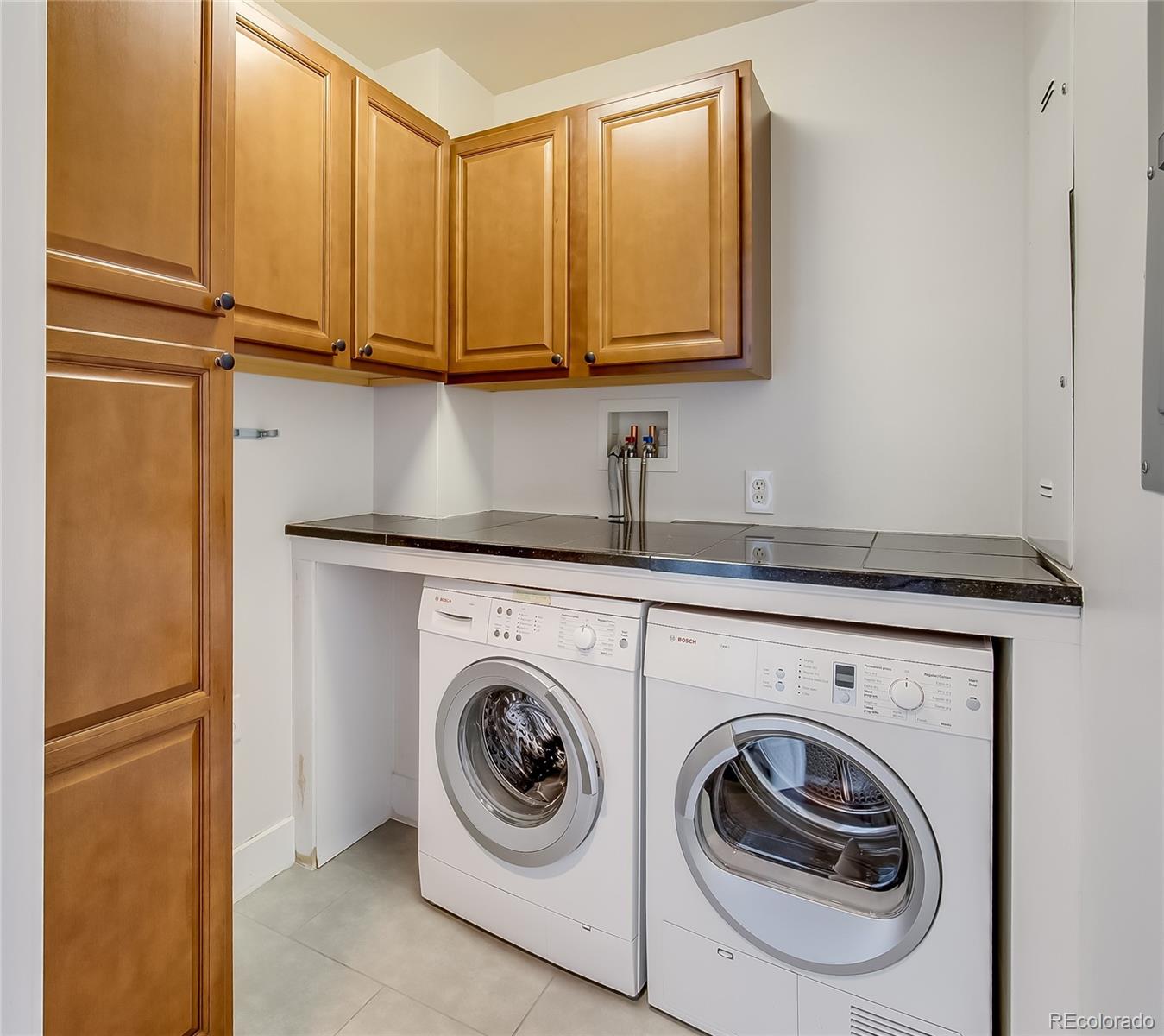 2001 Lincoln Street, Unit 1024 Denver, CO 80202 - Photo 11 of 19 a utility room with dryer and washer