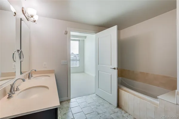 a bathroom with a sink and a bathtub