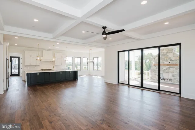 a kitchen with stainless steel appliances granite countertop a stove and cabinets