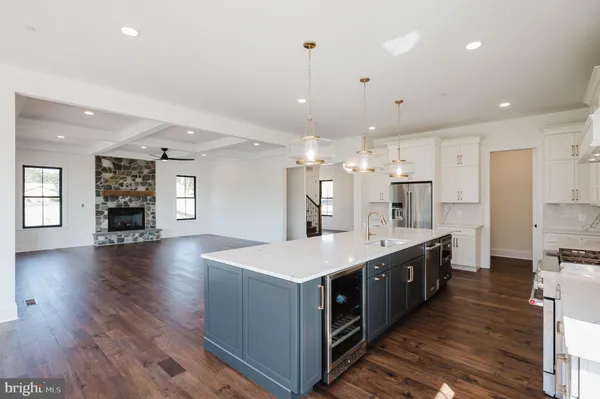 a bathroom with a double vanity sink a mirror and a bathtub
